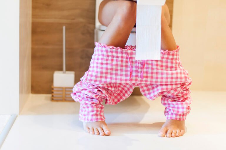 Close up of woman on toilet in morning
