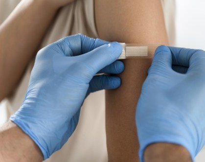 doctor-putting-bandage-patient-s-arm